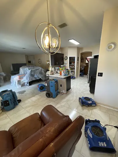 Air movers drying a living room after a leak in Altamonte Springs, FL