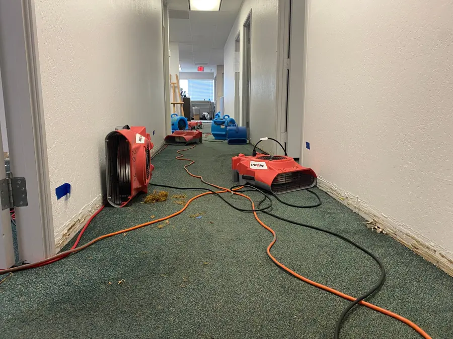 Air movers drying a hallway and carpet in Altamonte Springs, FL